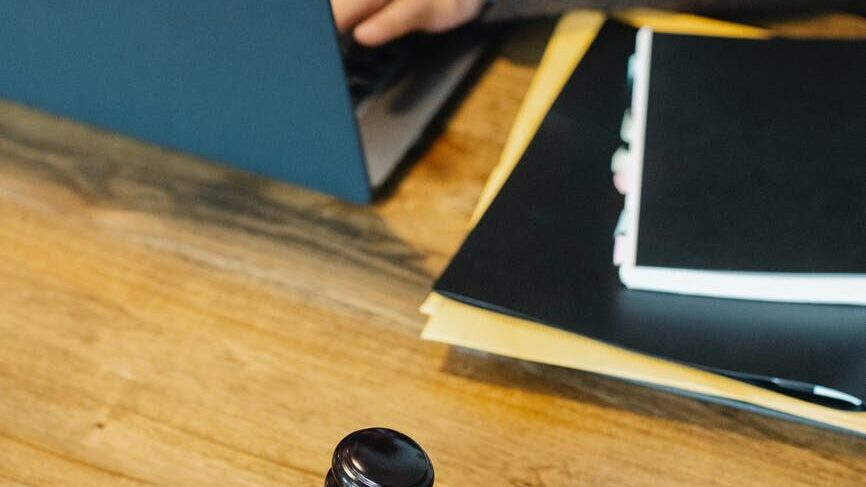 wooden gavel on wooden surface